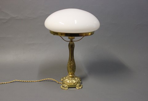 Tablelamp in brass with beautifully foot and White glass dome. 

