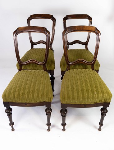 Set of four dining room chairs of mahogany and upholstered with green fabric 
from the 1890s. 
5000m2 showroom.
