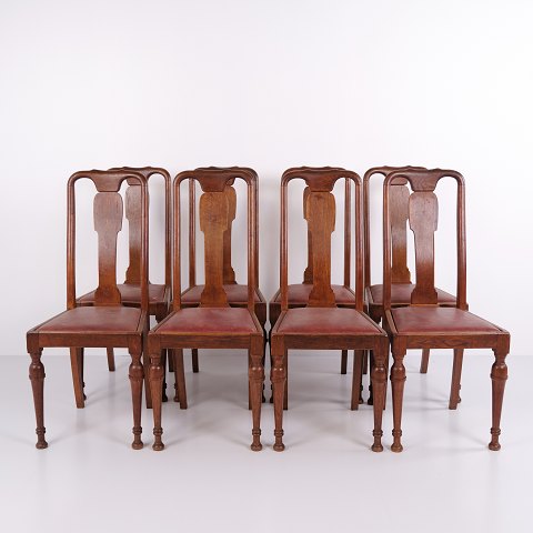 Ensemble de 8 chaises de salle à manger en bois foncé et cuir rouge des années 1920