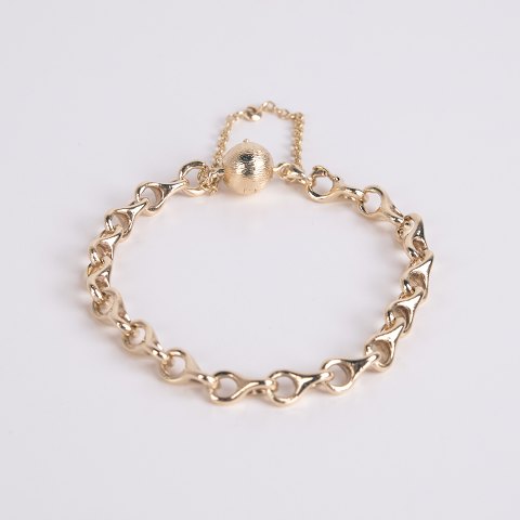Bracelet en or Ole Lynggaard en or 14 carats avec maille iconique en forme de huit et fermoir d
