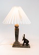 Table lamp made of marble with decorativ elephant.
