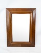 Mirror in walnut of danish design from the 1920s.
