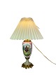 Table lamp of porcelain with motif and bronze from around the 1920s. 
Great condition
